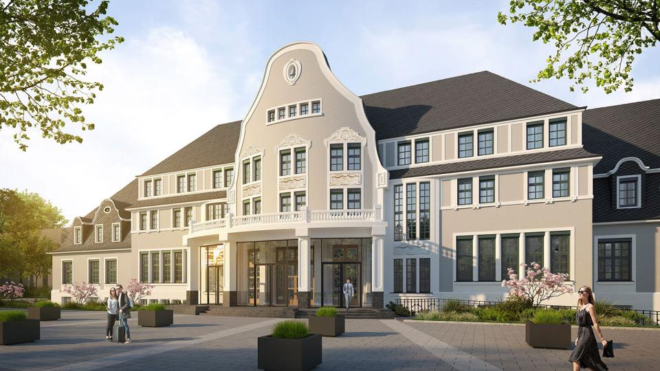 Elegant white building with large windows, set against a clear sky. People walk on a paved plaza with planters. Trees frame the scene.